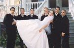 Groomsmen carrying Bride